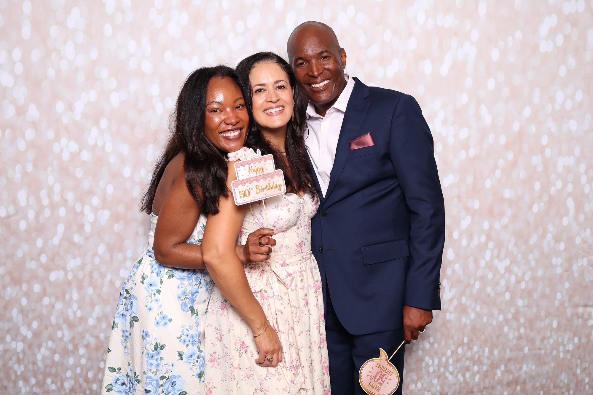 Guests celebrating a 50th birthday at the RicheMoments photo booth