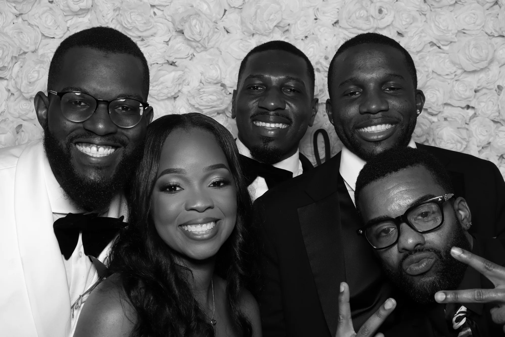 Black-tie wedding guests gathered for a RicheMoments photo booth portrait