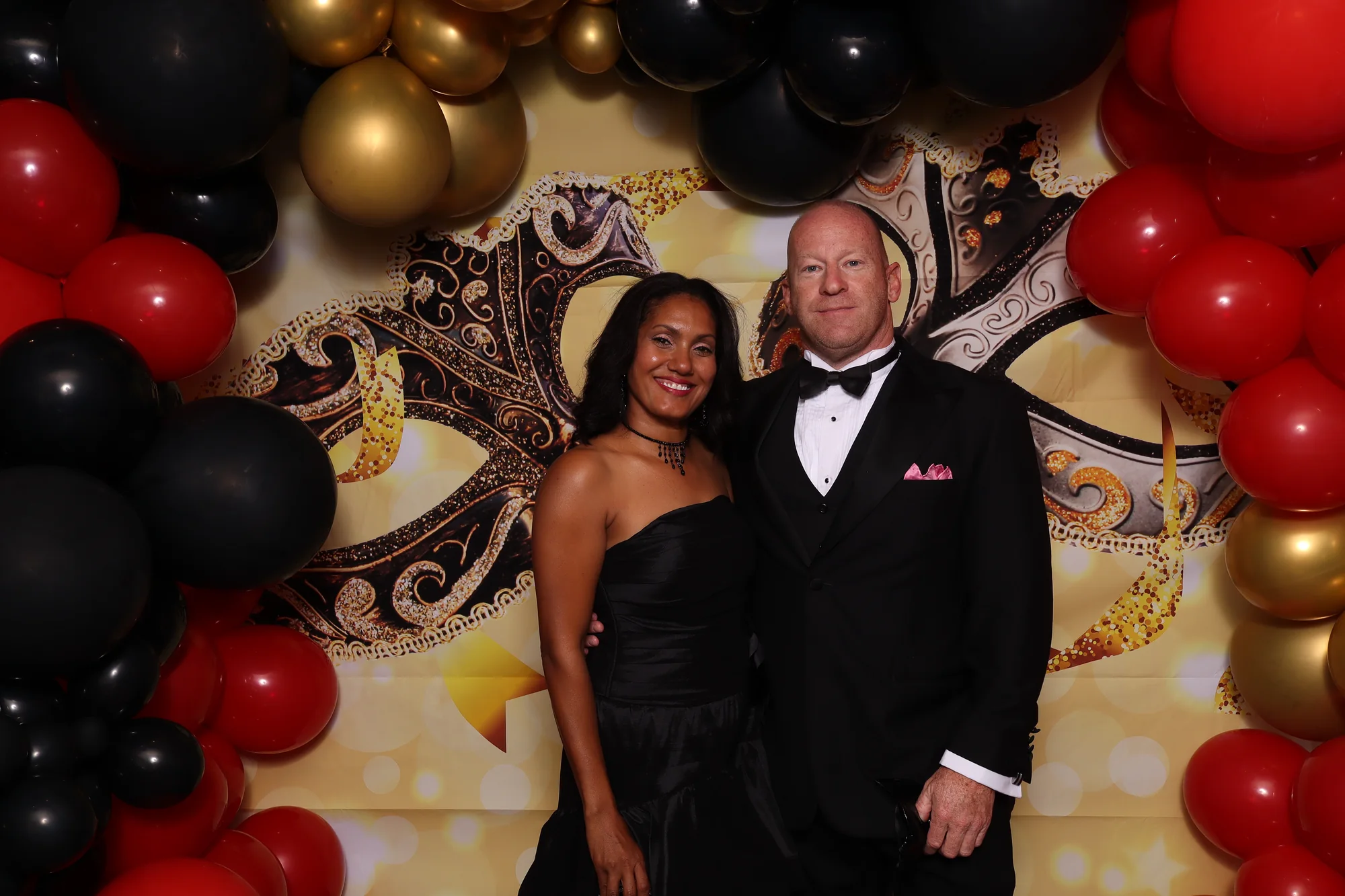 Formal gala guests posing at a RicheMoments photo booth