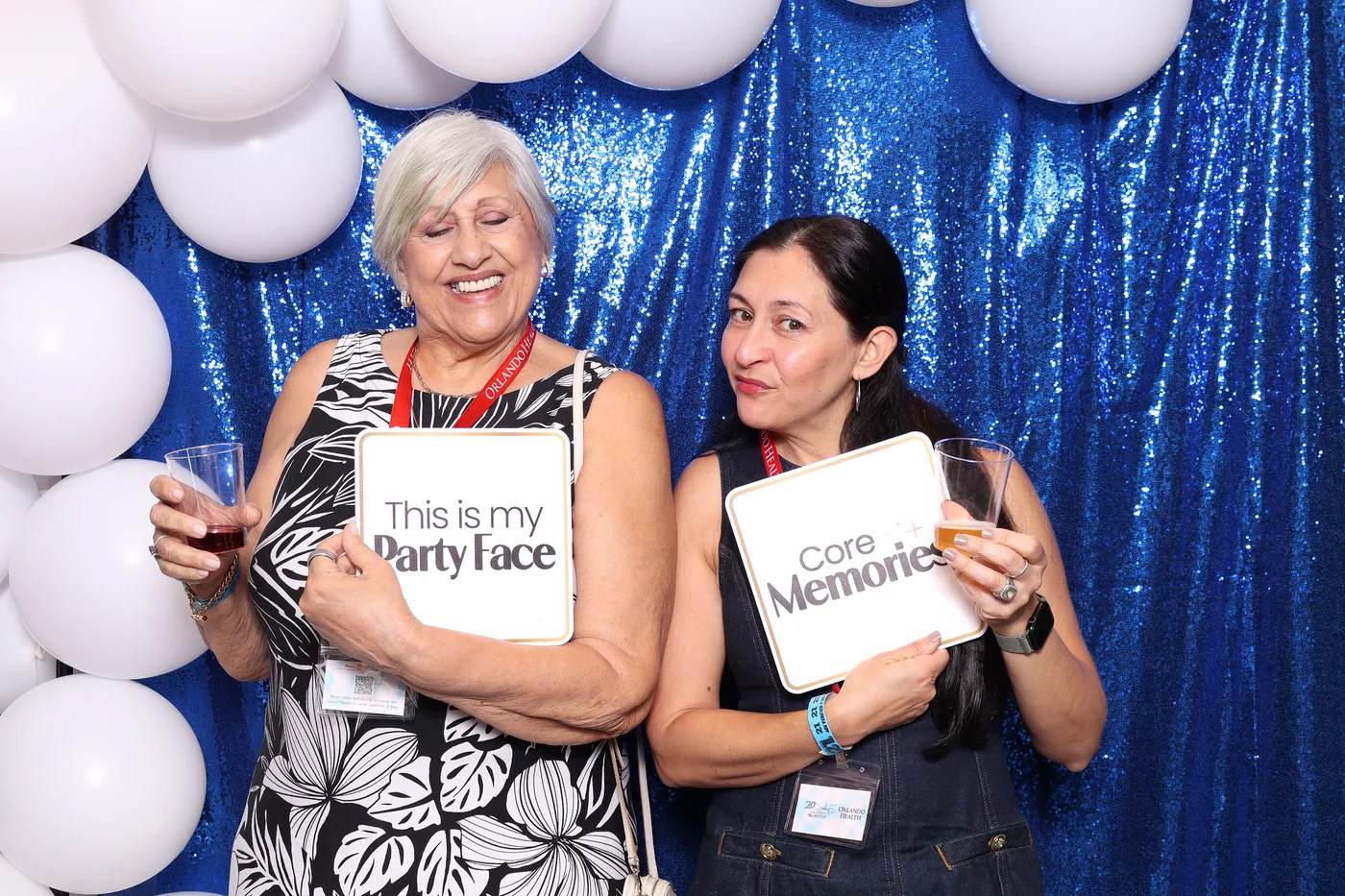 A multi-generational group having fun at the Taste of Lake Mary photo booth