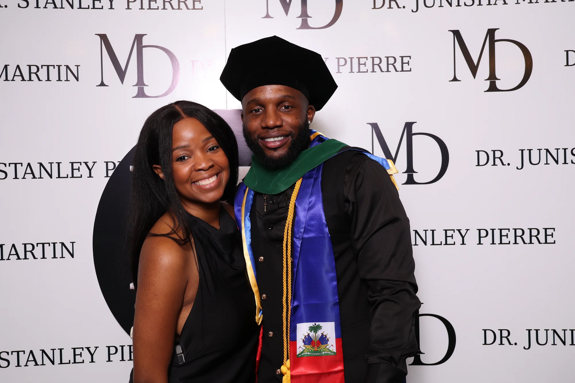 Guests celebrating White Coats and Champagne at a RicheMoments photo booth
